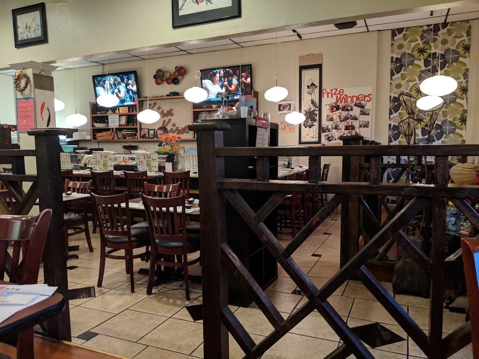 A Japanese restaurant table with shared plates.